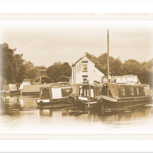 Vintage-effect landscape image of canal boats at Swarkestone Lock