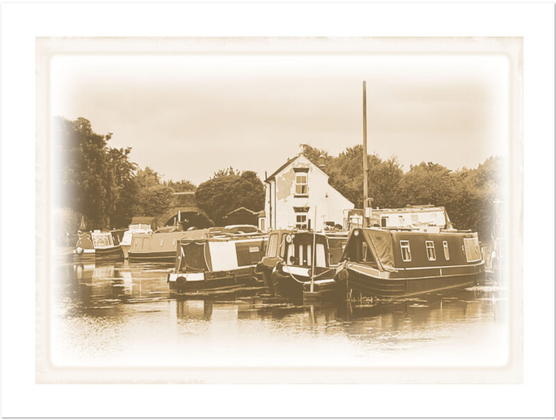 Vintage-effect landscape image of canal boats at Swarkestone Lock