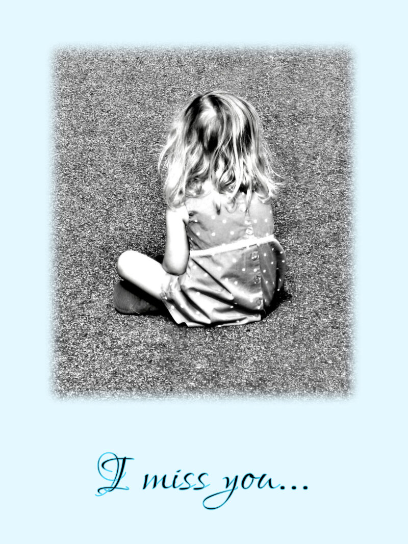 small girl sitting cross-legged on asphalt with back to camera and blue background. I miss you card